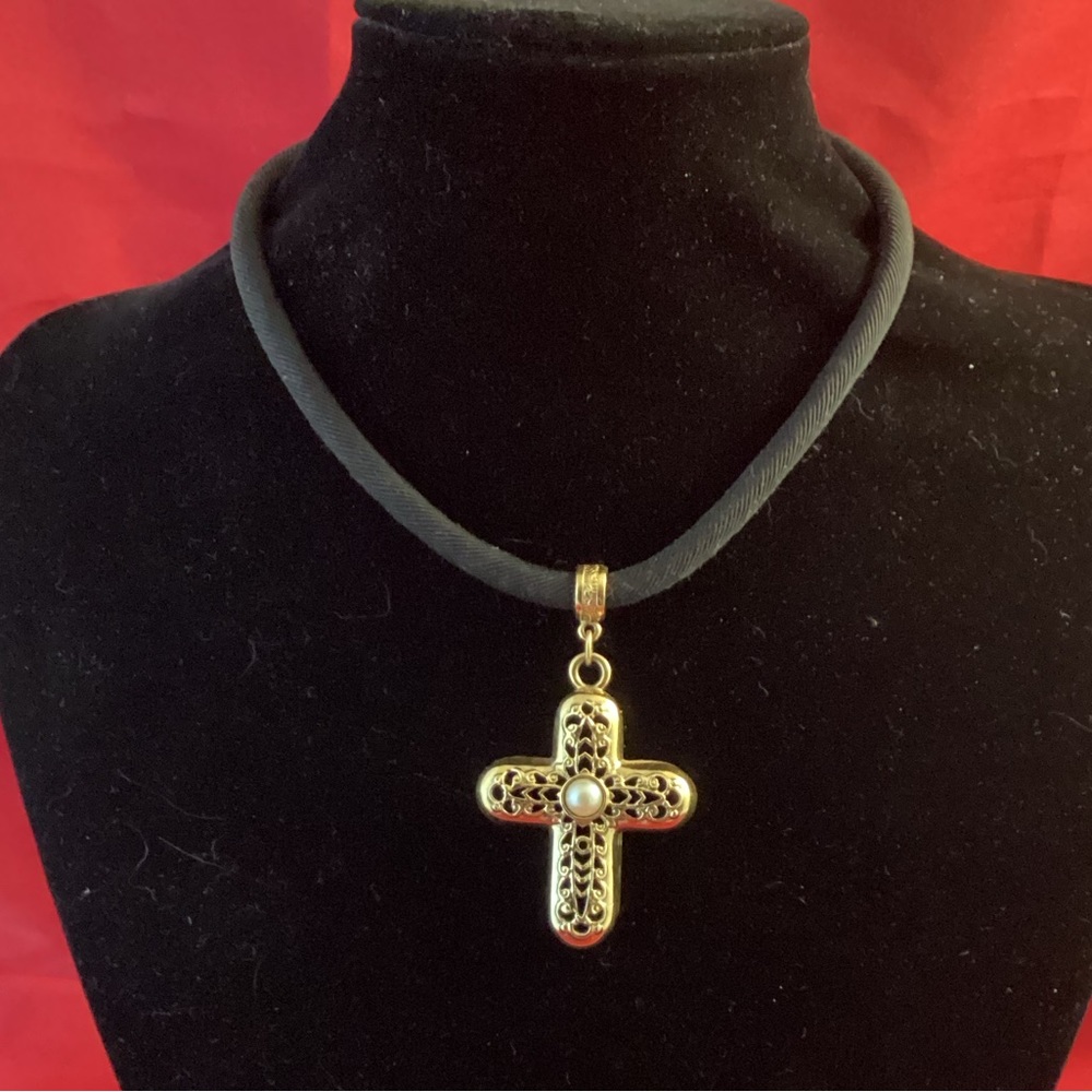1928 Gold tone cross on a black fabric lace